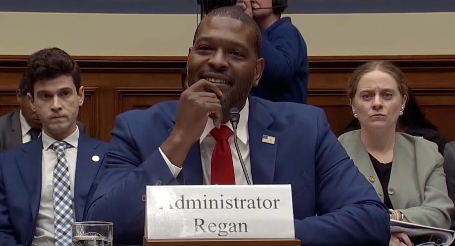 Michael Regan, head of the EPA, stares at Representative Lauren Boebert during a hearing on Wednesday